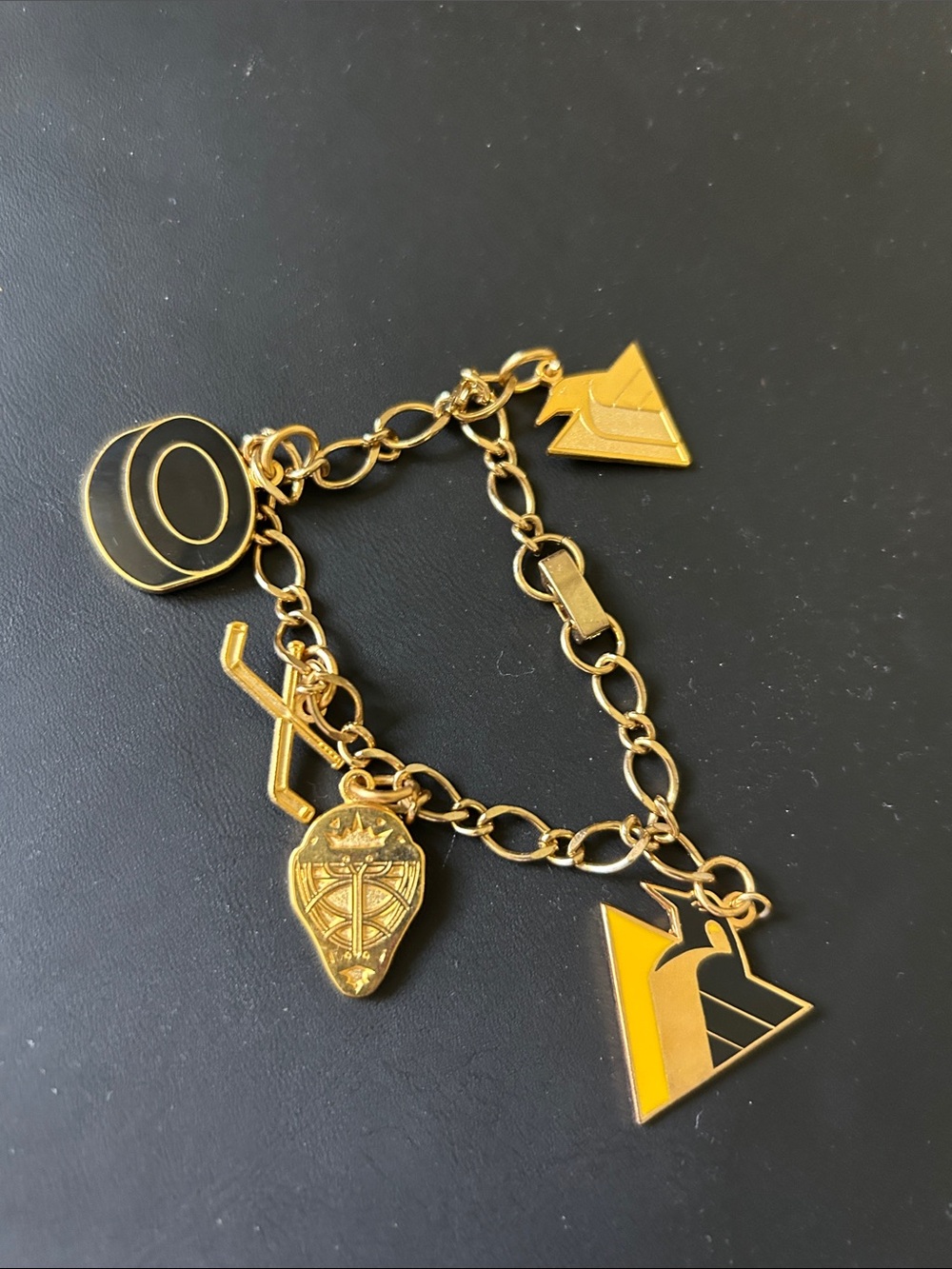 Gold-Tone Hockey Charm Bracelet with Black & Yellow Enamel Accents